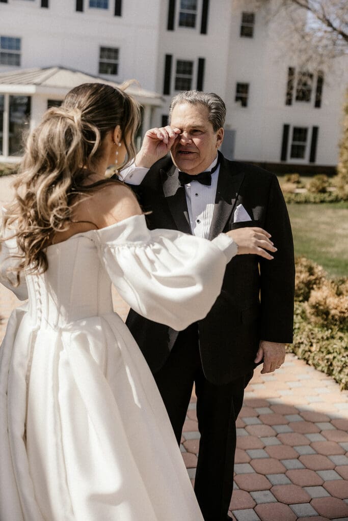 Father of the bride getting emotional after the first look.