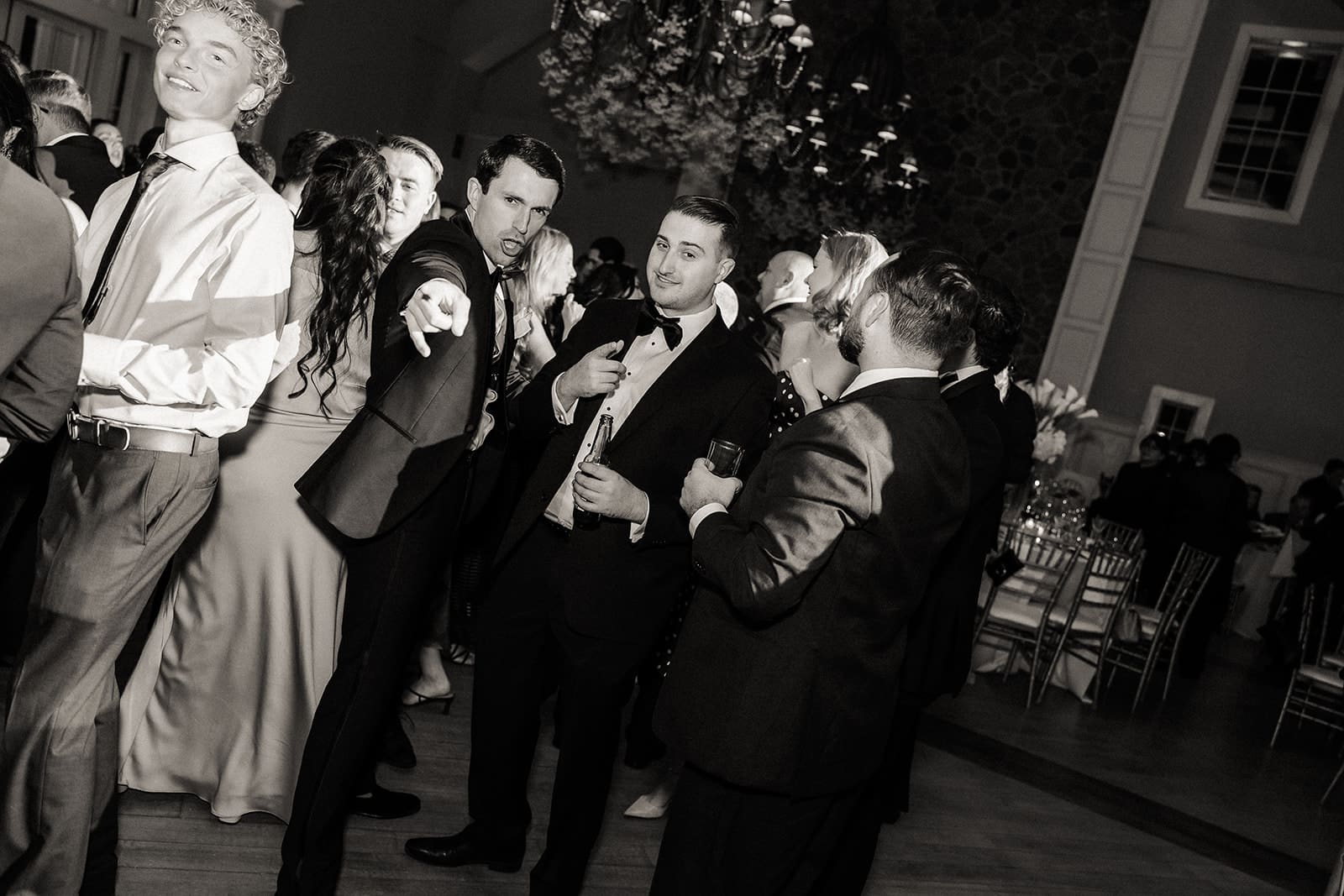 Black and white photo of guests during the reception.