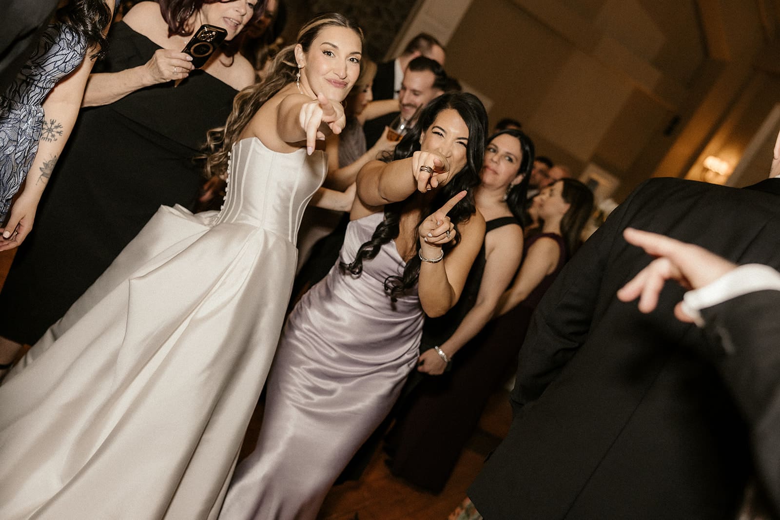Bride and bridesmaids dancing during the reception at The Ryland Inn.