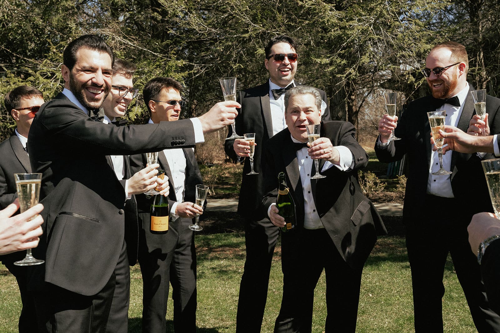 The groom and groomsmen having champagne.