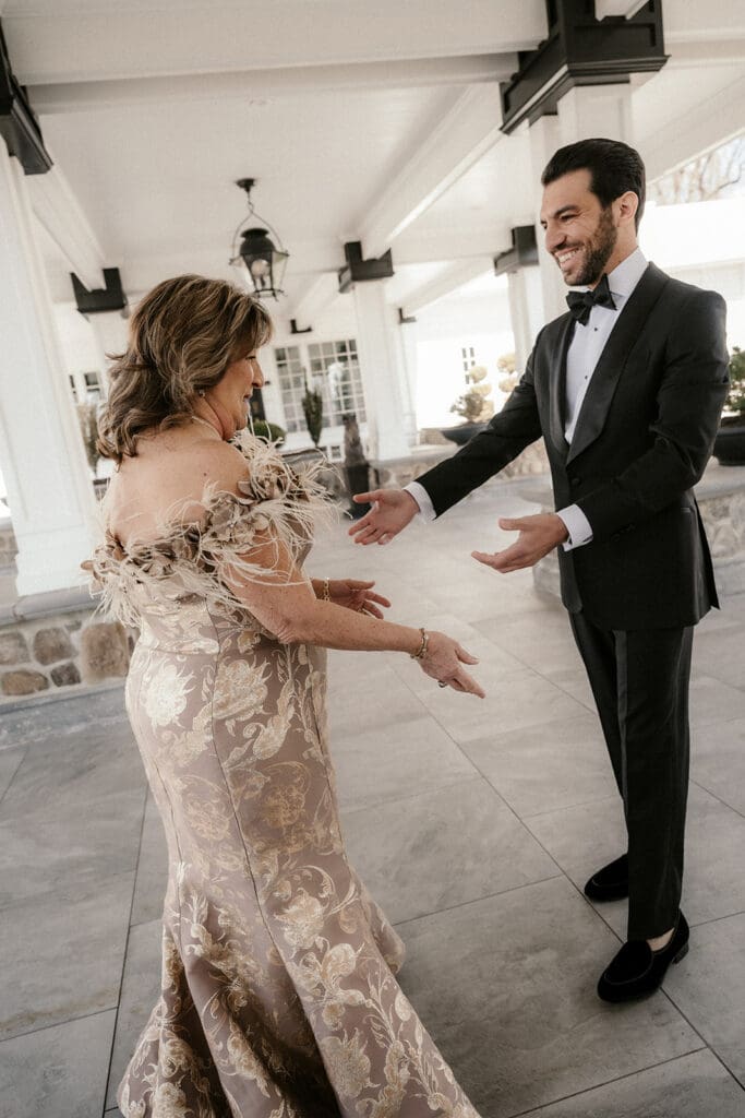 The groom sharing a first look with his mother.