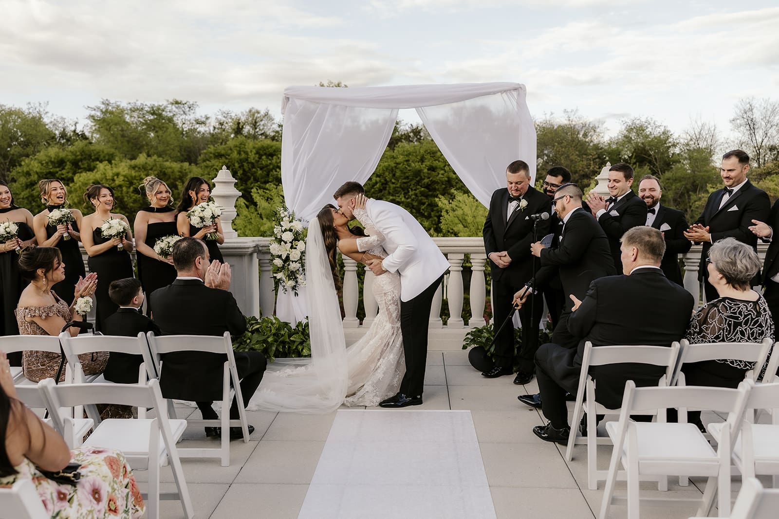 Bride and groom sharing a kiss during the ceremony.