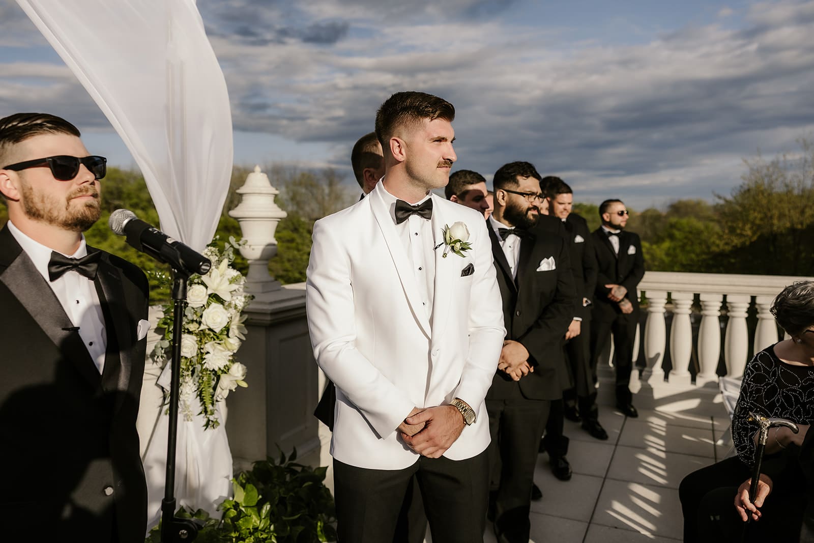 Groom watching the bride walk down the aisle for their palace at Somerset wedding ceremony.