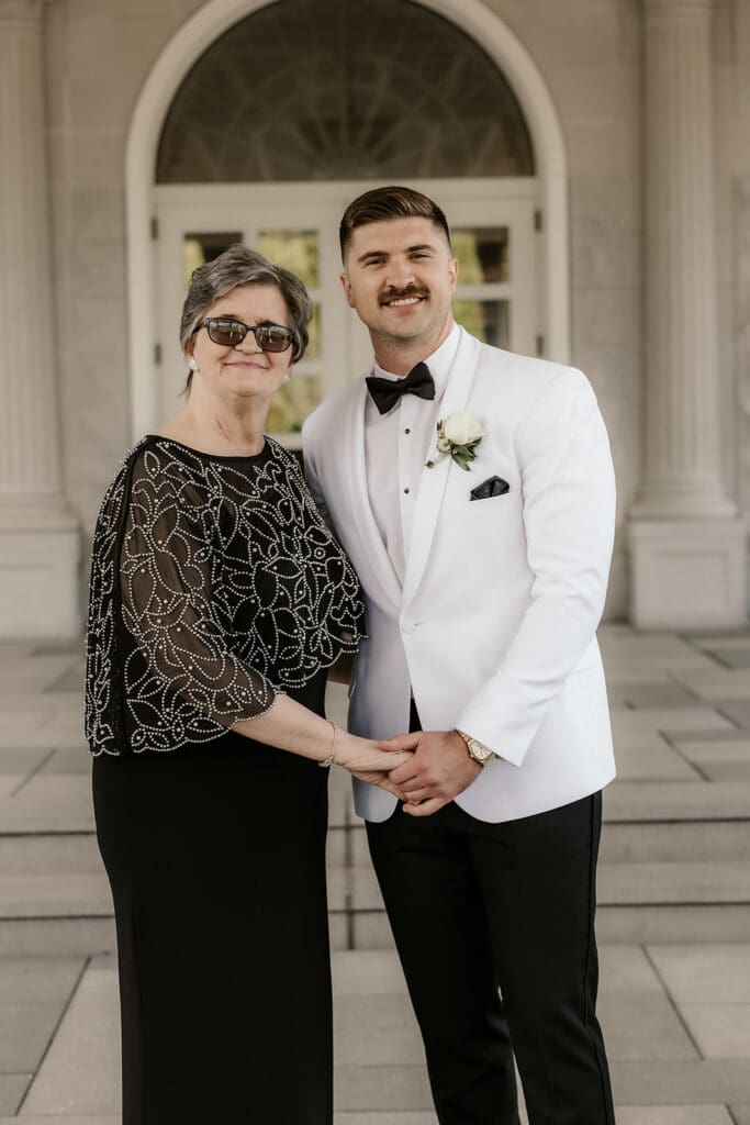 Groom posing with his mother.