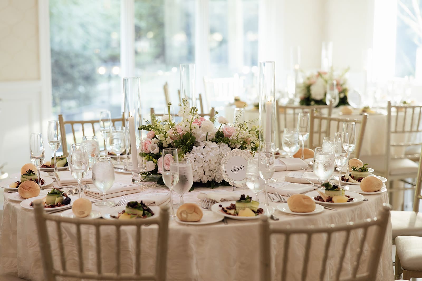 Elegant indoor wedding reception setup in The Ballroom at The English Manor in Ocean, New Jersey. 